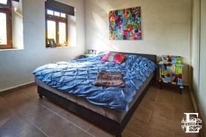 Postel nebo postele na pokoji v ubytování Patrimonium Wellness Apartments + 15 fotografií