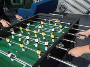 a foosball table with a group of players on it at ibis Paris Pantin Eglise in Pantin