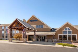 a rendering of the front of a hotel at AmericInn by Wyndham Laramie Near University of Wyoming in Laramie