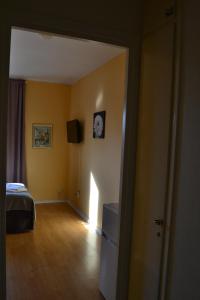 Postel nebo postele na pokoji v ubytování Hotell Skinnargården