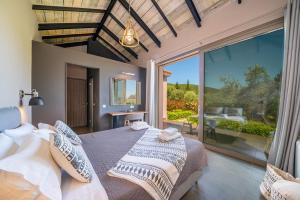 Posteľ alebo postele v izbe v ubytovaní Villa Ambrosia Sami by Villa Plus