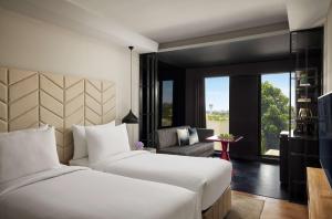 Postel nebo postele na pokoji v ubytování Hyatt Centric Juhu Mumbai