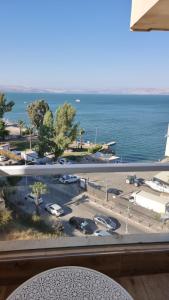 a view of a parking lot and the ocean at Kings Towers in Tiberias