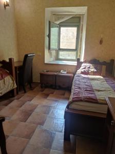 Ένα ή περισσότερα κρεβάτια σε δωμάτιο στο Akkotel-Boutique hotel