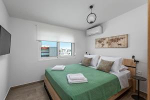 Posteľ alebo postele v izbe v ubytovaní Sky High Loft