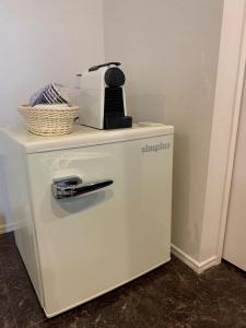 a white refrigerator with a coffee maker on top of it at Kamiamakusa - House - Vacation STAY 54914v in Kami Amakusa