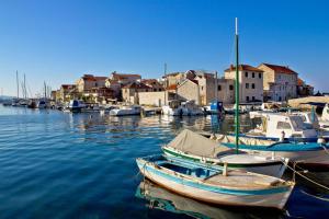 a group of boats are docked in a harbor at Apartment in Tribunj with sea view, terrace, air conditioning, WiFi 68-2 in Tribunj