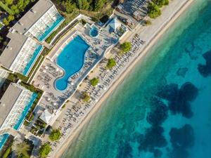 an aerial view of a pool and the ocean at TUI BLUE Adriatic Beach - All Inclusive - Adults Only in Igrane