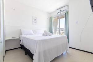 Ένα ή περισσότερα κρεβάτια σε δωμάτιο στο Exclusivo duplex no Beach TownHouse IV por Carpediem