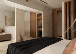 a bedroom with a black and white bed and a closet at The Syntopia Hotel - Adults Only in Adelianos Kampos