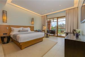 Voodi või voodid majutusasutuse Savoy Seychelles Resort & Spa toas