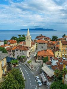 an aerial view of a town with a street and a church at VitaminSea - Lovran in Lovran