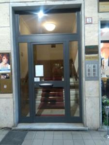 a glass door of a building with a table at LA ROMANTICA RAPALLO in Rapallo +10 photos