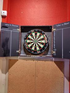 a dart board sitting on top of a wall at The Lampet Arms in Banbury