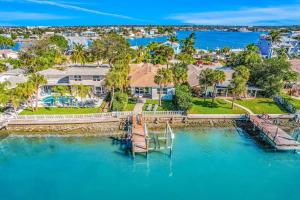 an aerial view of a house with a dock in the water at Indian Rocks Beach Hideaway in Clearwater Beach