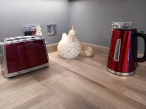 a kitchen counter with a toaster and a toaster oven at Hayfellside Nook in Kendal