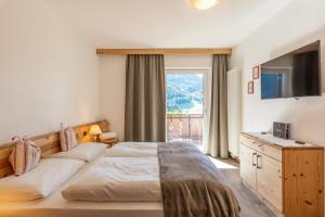Postel nebo postele na pokoji v ubytování Residence Prapoz