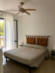 Ένα ή περισσότερα κρεβάτια σε δωμάτιο στο Appartamento Porta Marina