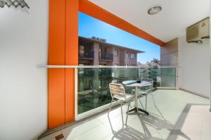 a balcony with a table and chairs on it at Delfino Apart Hotel in Alanya