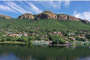 a small town on the shore of a body of water at The Windsor- Hartbeespoort Dam in Hartbeespoort