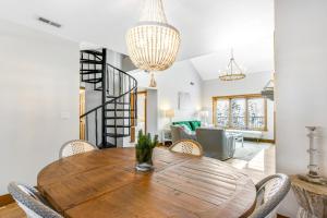 a dining room with a wooden table and chairs at 2 Bed 2 Bath Apartment in Avon in Avon