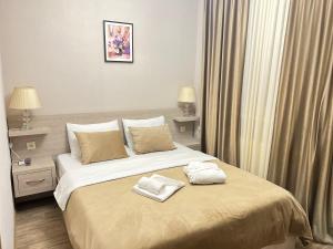 Voodi või voodid majutusasutuse Family Hotel Triston toas