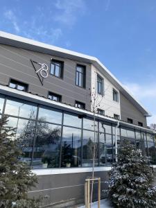 a large building with a lot of windows at Hotel 78 Cafe in Karakol