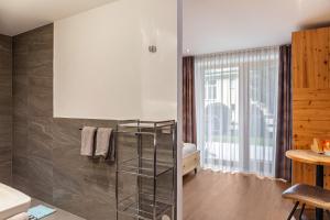 Łóżko lub łóżka w pokoju w obiekcie Apart-hochzillertal Gartenwohnung