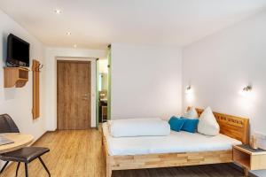 Łóżko lub łóżka w pokoju w obiekcie Apart-hochzillertal Gartenwohnung