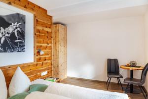 Łóżko lub łóżka w pokoju w obiekcie Apart-hochzillertal Gartenwohnung