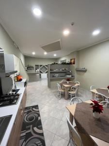 a kitchen and dining room with a table and chairs at lolly in Paravati +16 photos
