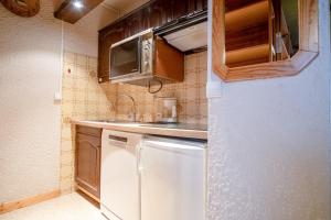 Η κουζίνα ή μικρή κουζίνα στο Appartement El Santa - Welkeys +4 φωτογραφίες
