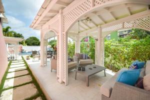 a white gazebo with couches and a table at Blessed Manor by Bluescape in Bridgetown +7 photos