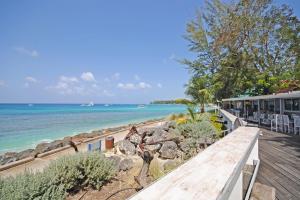 a view of the beach from the deck of a house at The Falls Townhouse 10 by BSL Rentals in Saint James