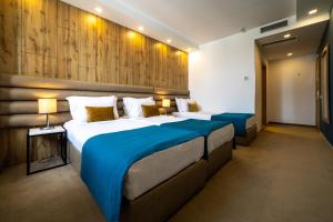 Postel nebo postele na pokoji v ubytování MARK Hotel