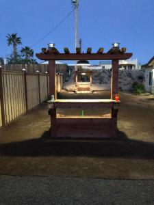 a small wooden structure in the middle of a street at Area 51 Annex - Alien Lake Escape in Bullhead City +25 photos