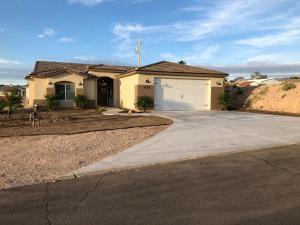a house with a garage and a driveway at Area 51 Annex - Alien Lake Escape in Bullhead City