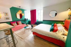 Łóżko lub łóżka w pokoju w obiekcie Appartement Bollyroom - Plage 50m - Rue gratuite