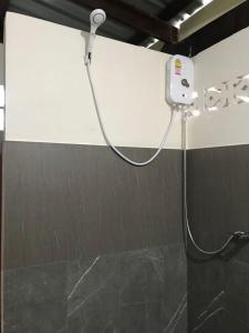 a shower in a bathroom with a shower head at Loma Sea Views in Ko Jum