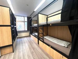 A bed or beds in a room at Onefam Budapest
