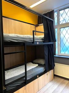 A bed or beds in a room at Onefam Budapest
