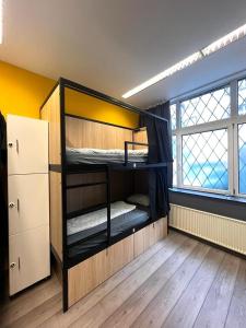 A bed or beds in a room at Onefam Budapest