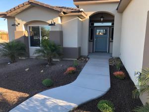a home with a walkway leading to the front door at Area 51 Annex - Alien Lake Escape in Bullhead City