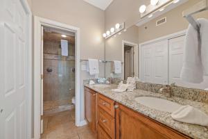 a bathroom with a sink and a shower at Tidewater 609 in Orange Beach +33 photos