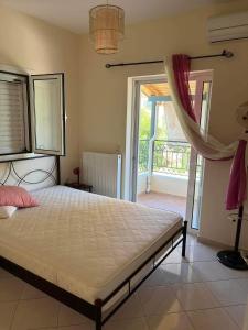 a bedroom with a bed and a large window at Two-floor fully equipped maisonette in the nature 