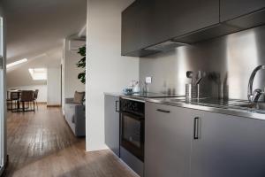 Kuchyň nebo kuchyňský kout v ubytování Civico25 Suite Hotel