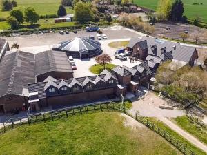 an aerial view of a building with a parking lot at Hanoverian Suite - Uk41830 in Tickton