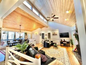 a living room with a couch and a ceiling fan at Black Bear Lodge in Basye