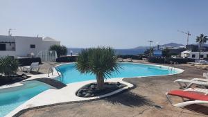 Bazén v ubytovaní Sea view paradise Lanzarote alebo v jeho blízkosti + 16 fotografií