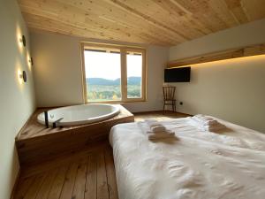 Postel nebo postele na pokoji v ubytování Casa amb jacuzzi privat, Cal Rossa